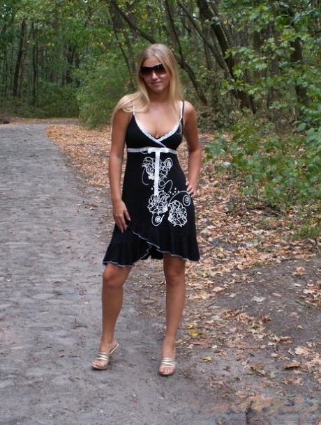 Naughty blonde strips naked & shows off her tanned tits outdoors