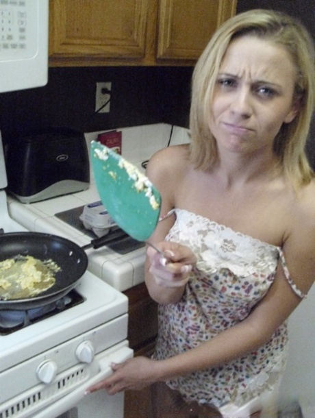 Pretty amateur wife Katty West strips and shows her big tits while cooking