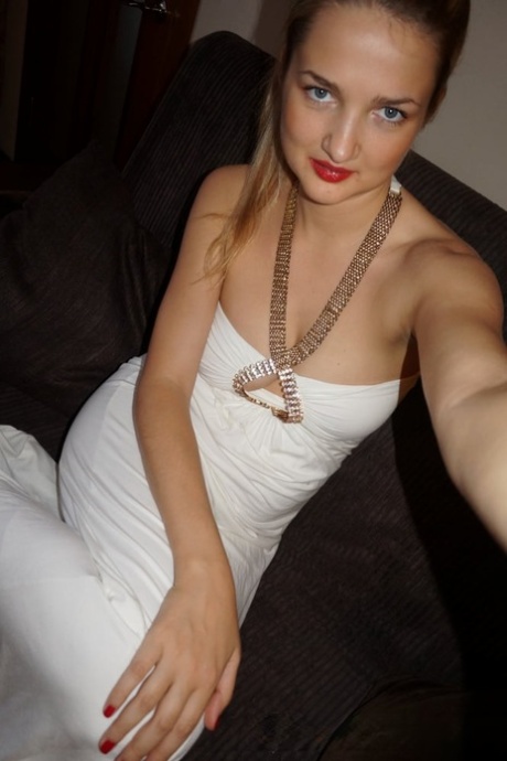 Blonde amateur shows her perfect teen tits while taking nude selfies