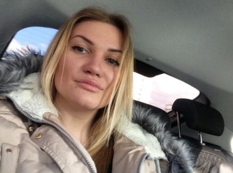 Blonde amateur shows off her juicy breasts & pussy while taking nude selfies