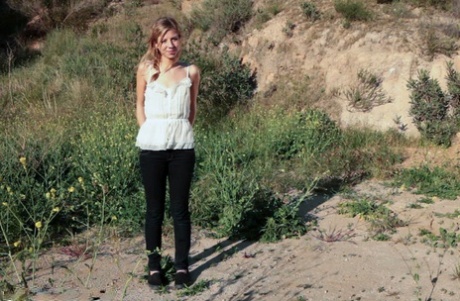 Young blonde Chastity Lynn gives a public blowjob to her man in the car