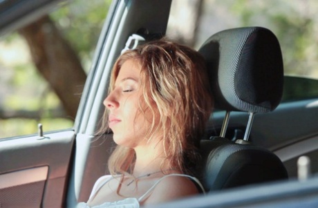 Young blonde Chastity Lynn gives a public blowjob to her man in the car