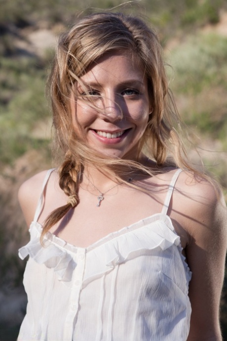 Young blonde Chastity Lynn gives a public blowjob to her man in the car