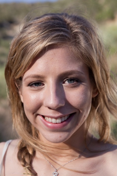 Young blonde Chastity Lynn gives a public blowjob to her man in the car