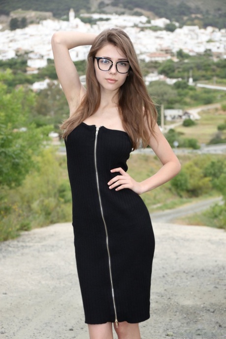 Nerdy teen Milla shows her tits and ass on a lookout spot over her town