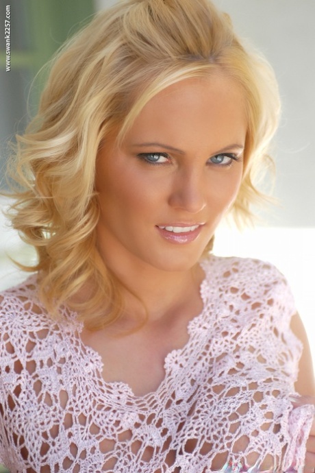 Blonde solo girl Hanna Hilton uncovers great tits as she disrobes