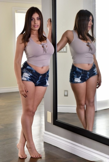 Chubby busty Ella Knox frees her huge natural tits to pose naked on the floor