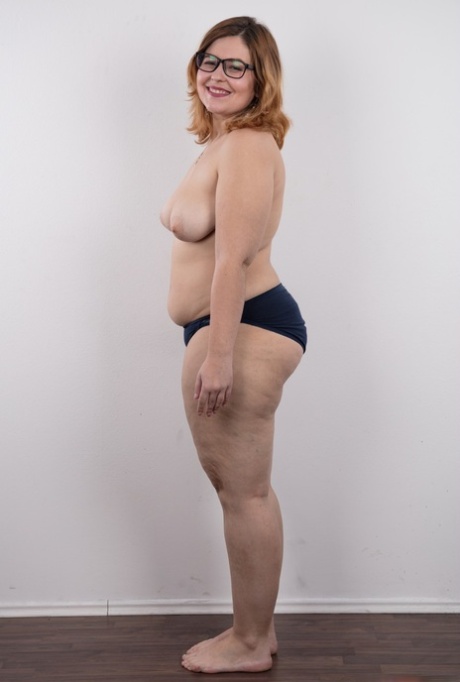 Amateur fatty Karolina shows her flab in the nude wit her glasses on