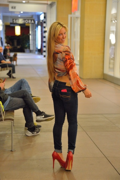 Skinny blonde teen Sydney shows her small ass and twat in public