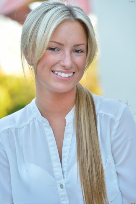 Skinny blonde teen Sydney shows her small ass and twat in public