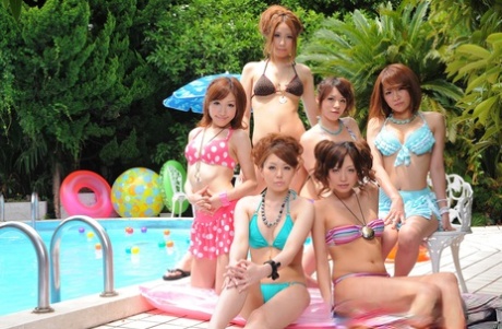Sweet Japanese girlfriends in sexy swimsuits flaunt their beauty poolside