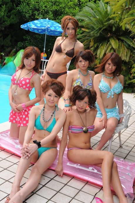 Sweet Japanese girlfriends in sexy swimsuits flaunt their beauty poolside