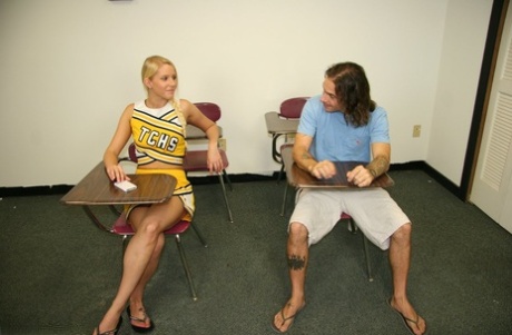 Blonde cheerleader Vanessa Cage unveils her perky tits before giving a handjob