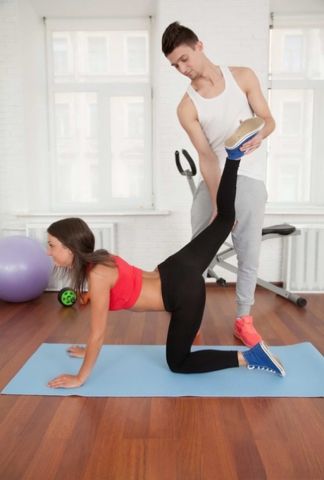 Athletic teen wears a cum facial after sex with her personal trainer