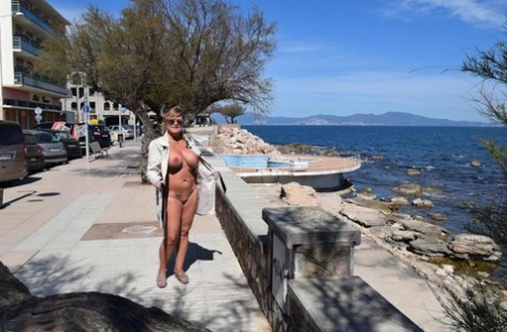 Shameless MILF Nude Chrissy flashes her big knockers and pussy in public