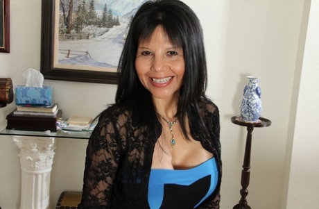 Mature slut Marcy Darling reveals her big tits in stockings