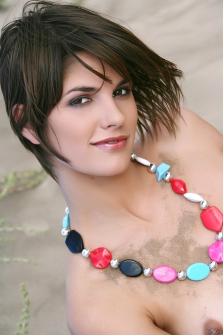 Nude teen babe Demi A posing in the sand and teasing with her sexy body