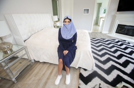 Charming Arab spreading legs to show pussy while wearing a hijab