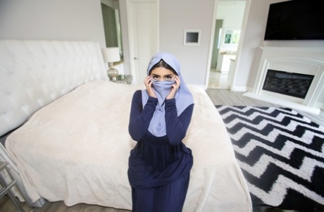 Charming Arab spreading legs to show pussy while wearing a hijab