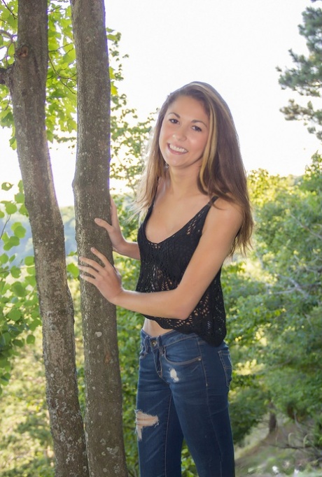 Amateur chick Becca Clark uncovers her nice tits out in the backyard