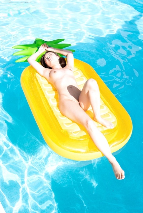 Tiny Asian teen Lulu Chu takes off her bikini while enjoying some pool time