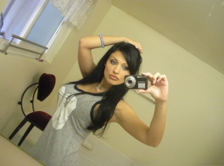 European chick Aletta Ocean takes topless selfies in mirror wearing a thong