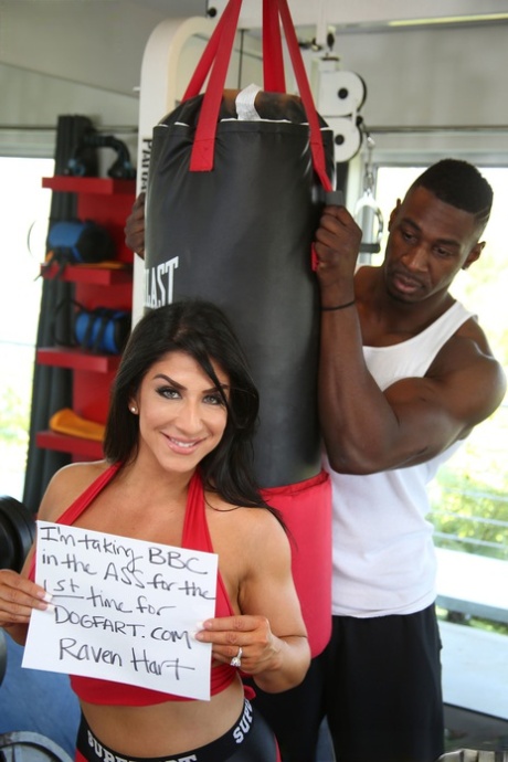 Sexy boxer cougar Raven Hart shows her big tits before an interracial rocking