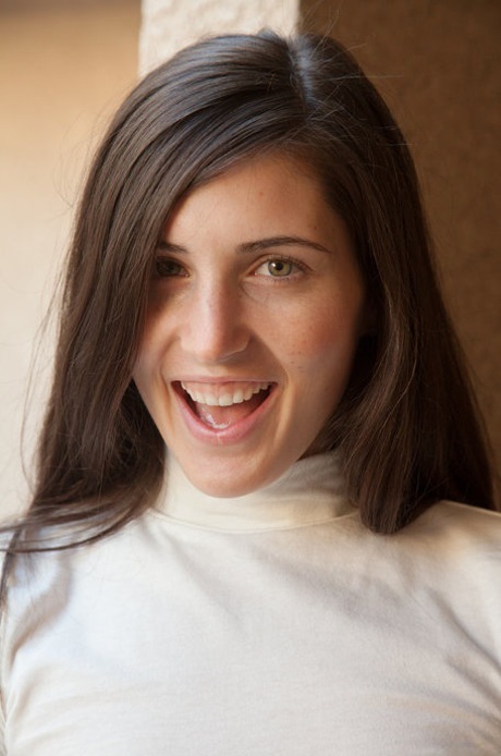 Geeky teen girlfriend Irene Quinn poses seductively in short skirt in public