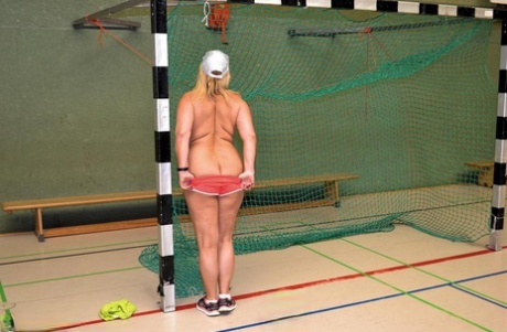 Busty mature fatty gets fitness coaching while stark naked in the school gym