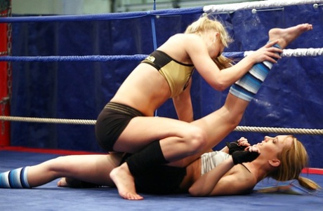 Stunning sporty lesbians get some pussy pleasure after wrestling