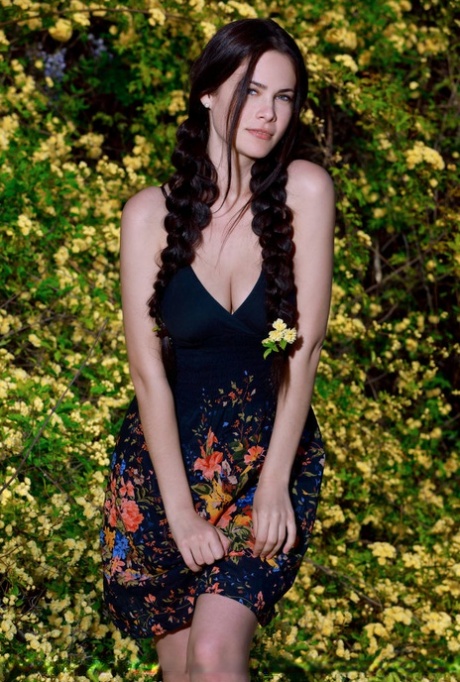 Sexy teen Martina Mink gets undressed in braided pigtails by flowering bushes