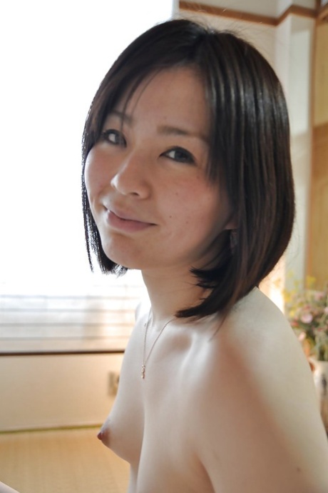 Amazing brunette babe Eriko loves to undress that cute looking pussy