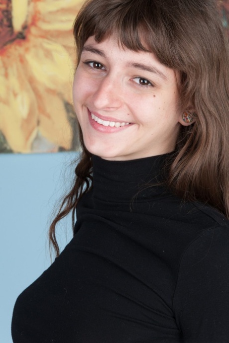 Brunette amateur Willow exposes her hairy armpits and her twat in a solo