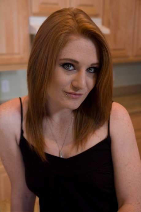 Horny housewife Lucy Fire tries out a sex machine on her tattooed pussy