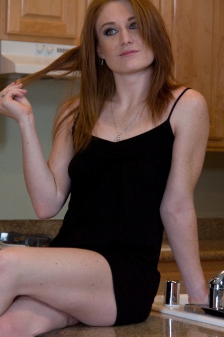 Horny housewife Lucy Fire tries out a sex machine on her tattooed pussy