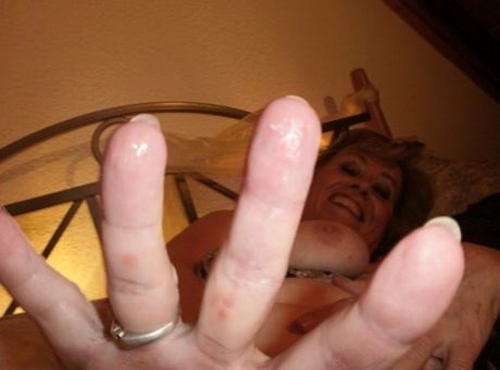 Horny old granny Caro bares saggy big tits & hairy pussy closeup in pantyhose