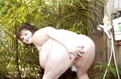 Mature BBW Scarlett Webb fondling huge boobs while masturbating pussy