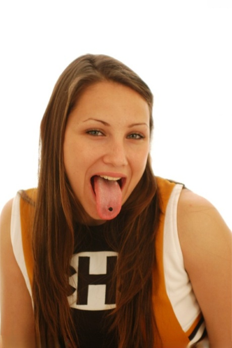 Hot cheerleader with a pierced tongue Michelle toys her bald vagina