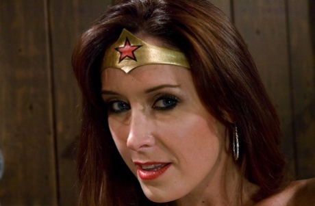 Christina Carter plays Wonder Woman during kinky Device Bondage porn shoot