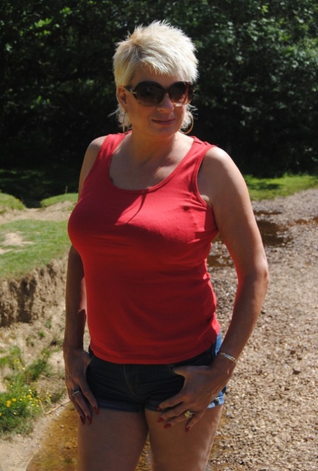 Hot mature lady Dimonty fondles her natural tits in bikini bottoms