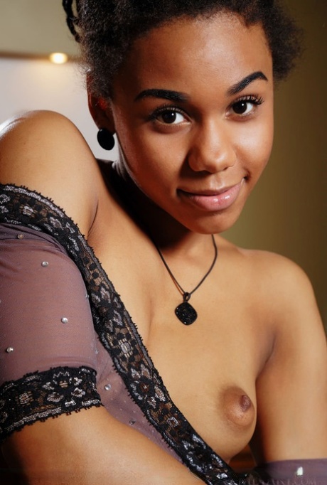 Exotic ebony Gana in sheer lingerie spreading ass & flaunting bald snatch