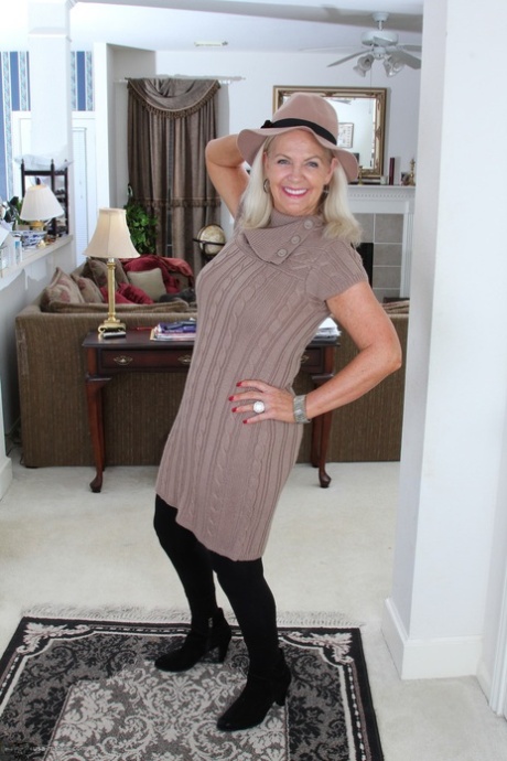 Clothed American granny peels off her tights and cast them aside