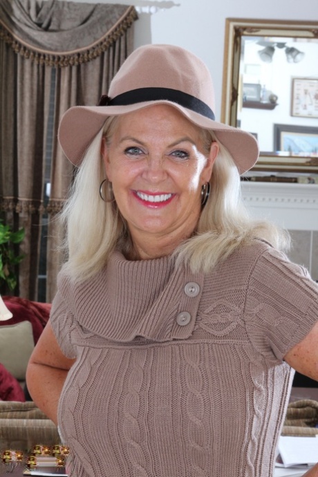 Clothed American granny peels off her tights and cast them aside