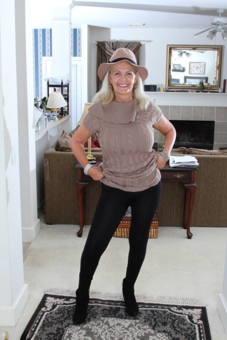 Clothed American granny peels off her tights and cast them aside