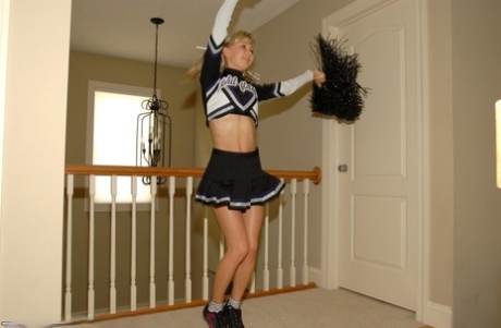 Adorable blonde teen Kasia exposes her big tits in cheerleader uniform