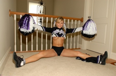 Adorable blonde teen Kasia exposes her big tits in cheerleader uniform