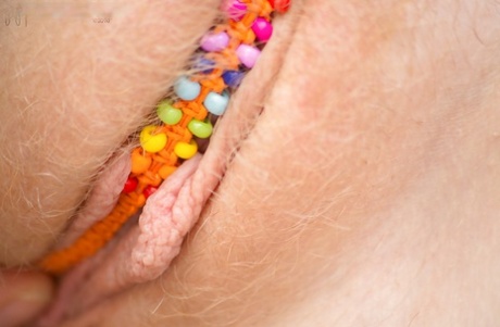 All natural redhead Emma B parting labia lips after undressing on patio