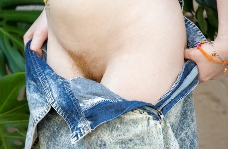 All natural redhead Emma B parting labia lips after undressing on patio