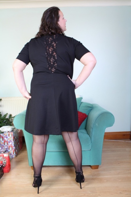 Brunette mom Eva Jayne removes her black dress and flaunts her curves