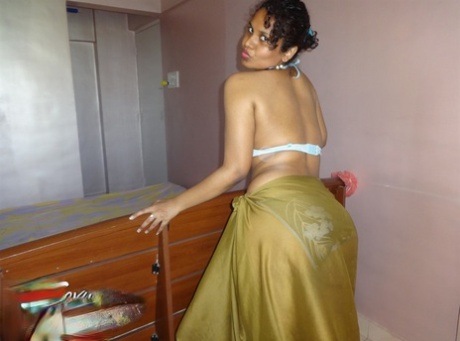 Indian woman lets a boob slip loose from her bra while being a tease